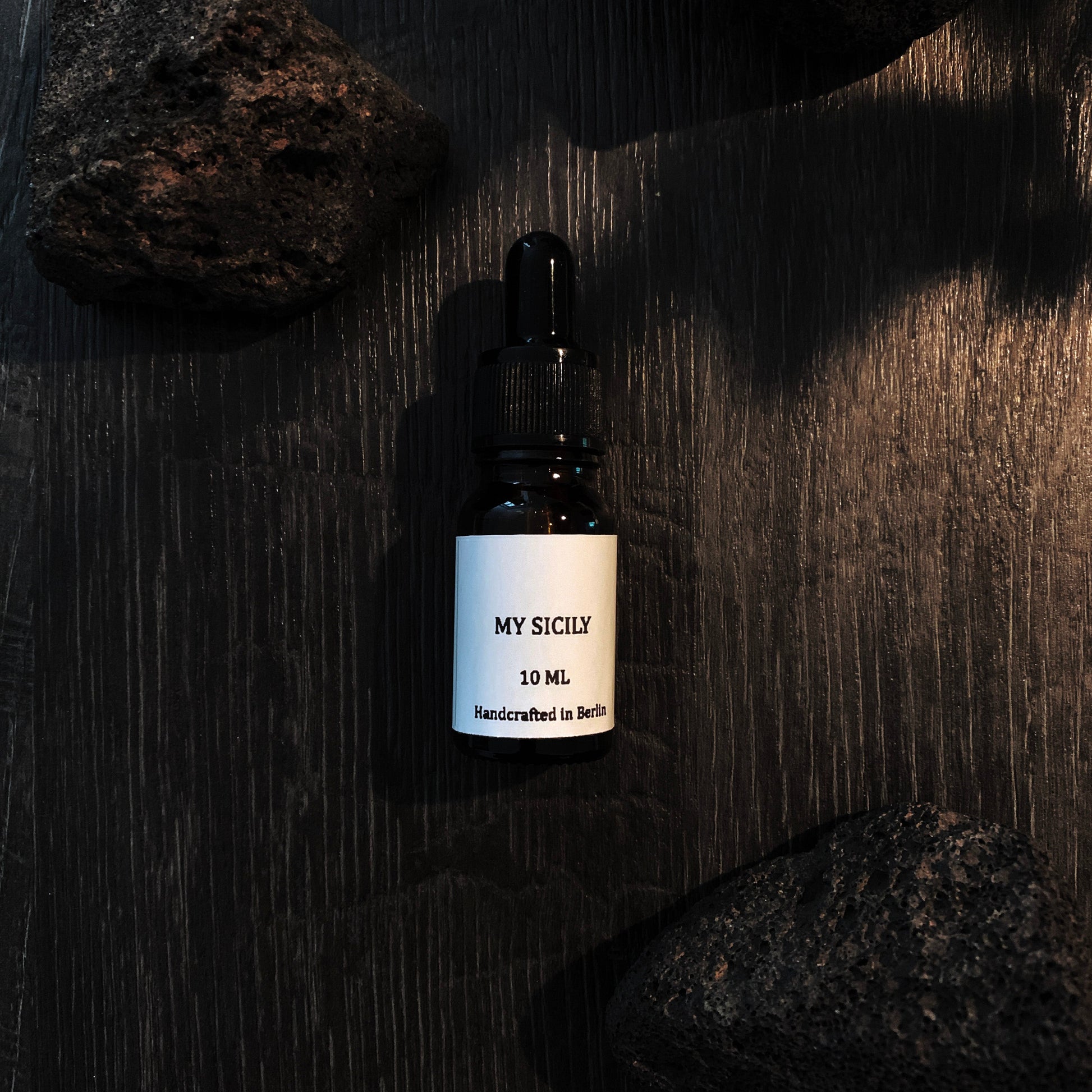 Bottle labeled 'MY SICILY' on a dark textured surface